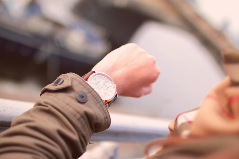 Selective Focus Photography of Person Watching Watch